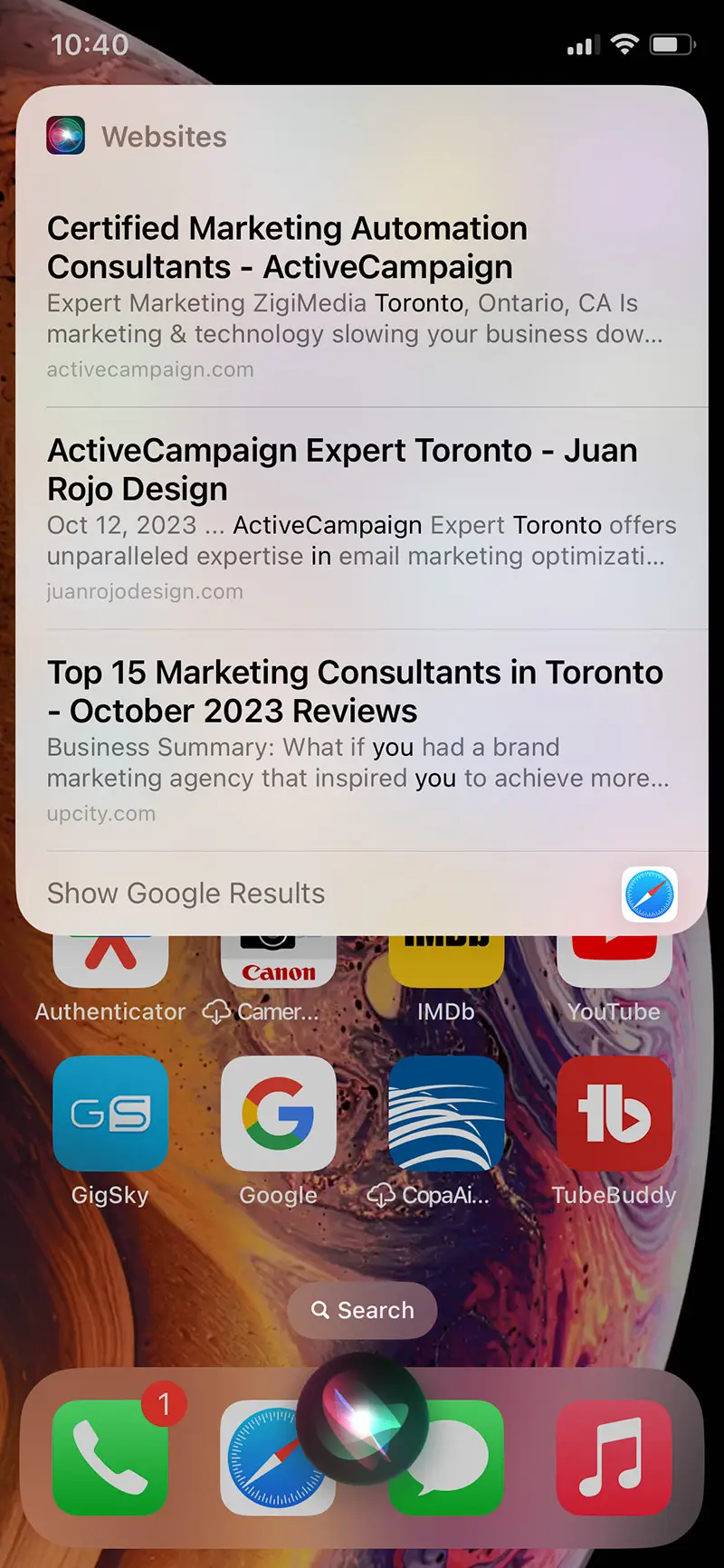 Voice Search Optimization | Screen shot of iPhone screen displaying search results after prompting Siri to find ActiveCampaign Experts in Toronto - Juan Rojo Design Toronto