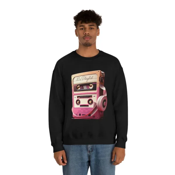 80s Playlist Sweatshirt Unisex, 80s retro hoodie, 80s style hoodie, 80s retro hoodie and Gen X | Picture of black man wearing a black sweatshirt with the graphic of a tape player with headphones sitting on top of it and on the tape label the words 80s Playlist have been written - Juan Rojo Design Toronto