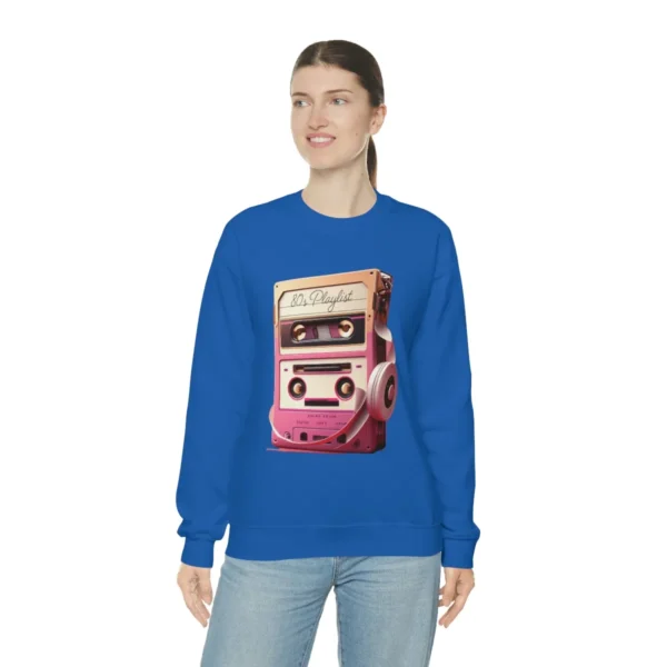 80s Playlist Sweatshirt Unisex, 80s retro hoodie, 80s style hoodie, 80s retro hoodie and Gen X | Picture of white woman wearing a navy blue sweatshirt with the graphic of a tape player with headphones sitting on top of it and on the tape label the words 80s Playlist have been written - Juan Rojo Design Toronto