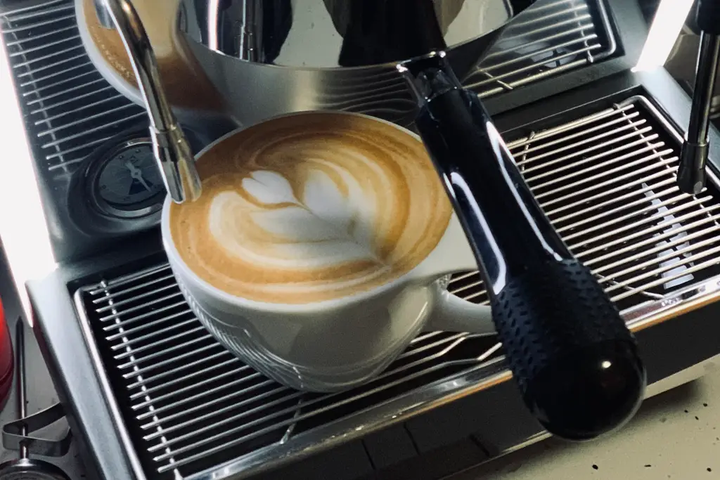Latte art on a cup of coffee - Juan Rojo Design Toronto